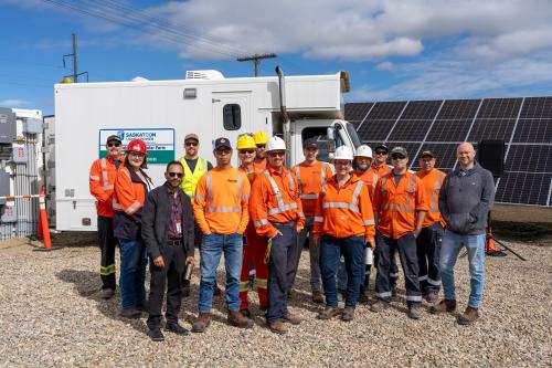 electrical workers that built the city's first solar farm